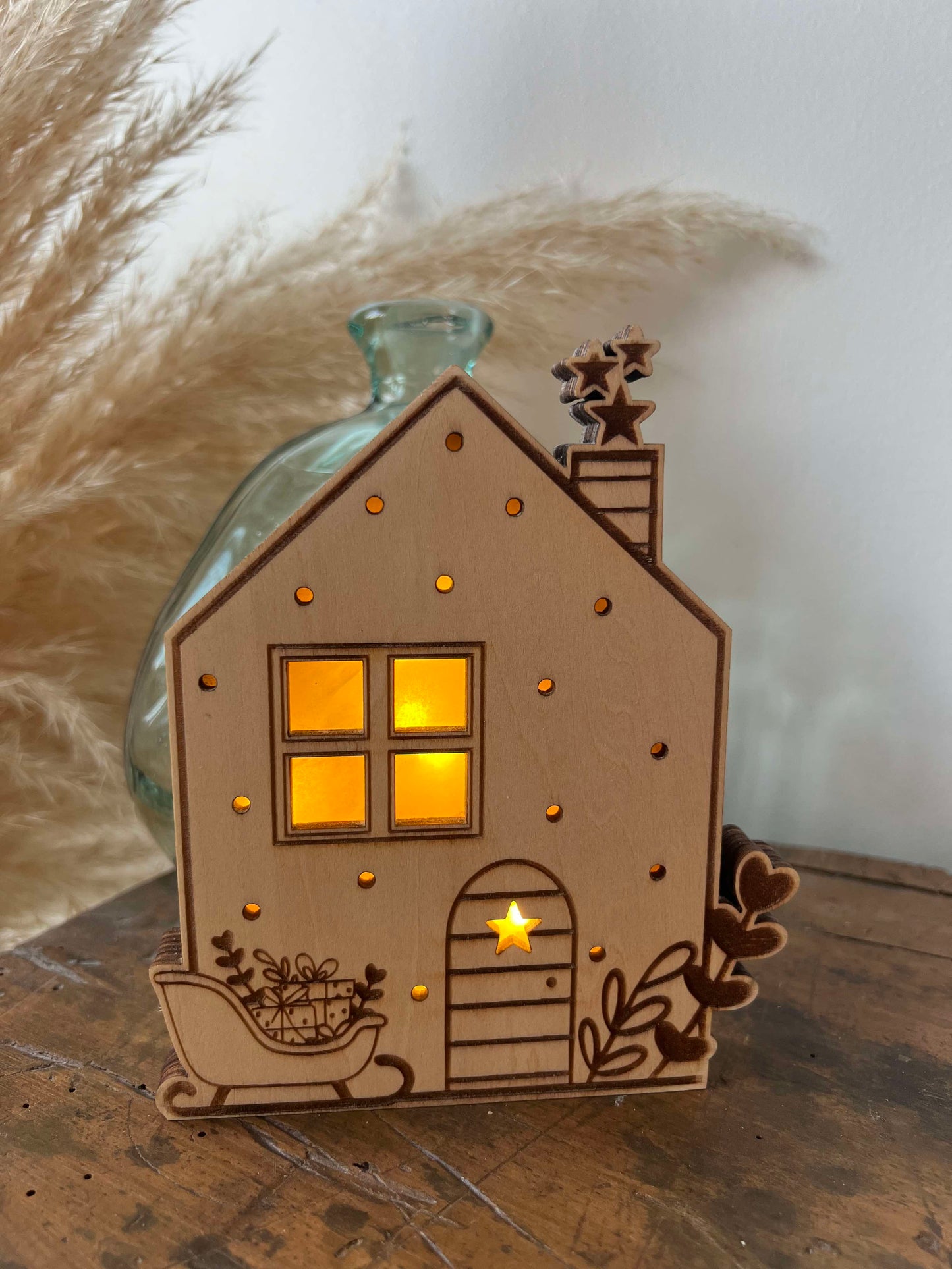 Maisons de Noël lumineuses et traineau