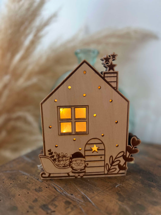 Maisons de Noël lumineuses et traineau